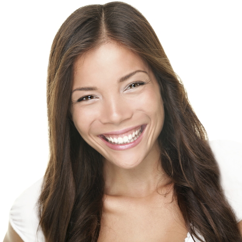 A young woman with long brown hair and a perfect smile thanks to general dentistry in Seattle
